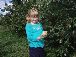 Ella picks an apple
