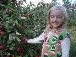 Abby picks an apple